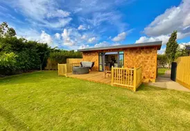 Securly fenced garden in a Mill Farm Leisure pet friendly lodge 3
