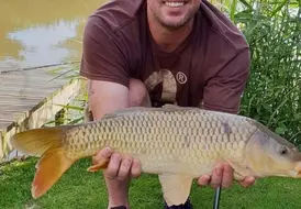 angler-with-large-carp-mill-farm-leisure-lincolnshire 50