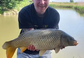 guest-holding-big-fish-mill-farm-leisure-holiday 60