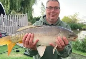 guest-holding-carp-fish-hot-tub-break-mill-farm-leisure 73