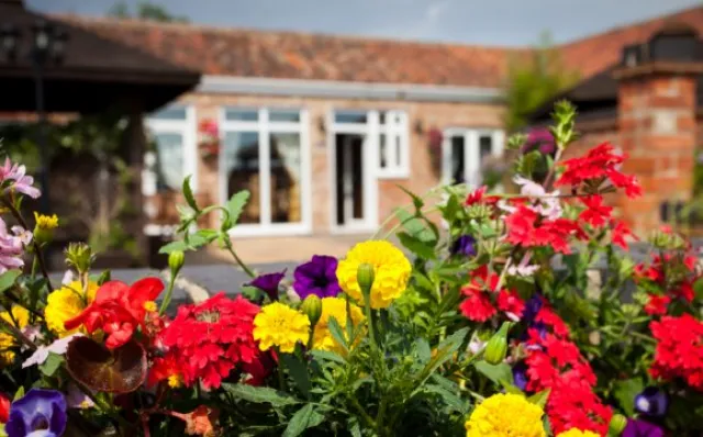 Stunning private courtyard with hot tub at Hawthorne Cottage, Mill Farm Leisure